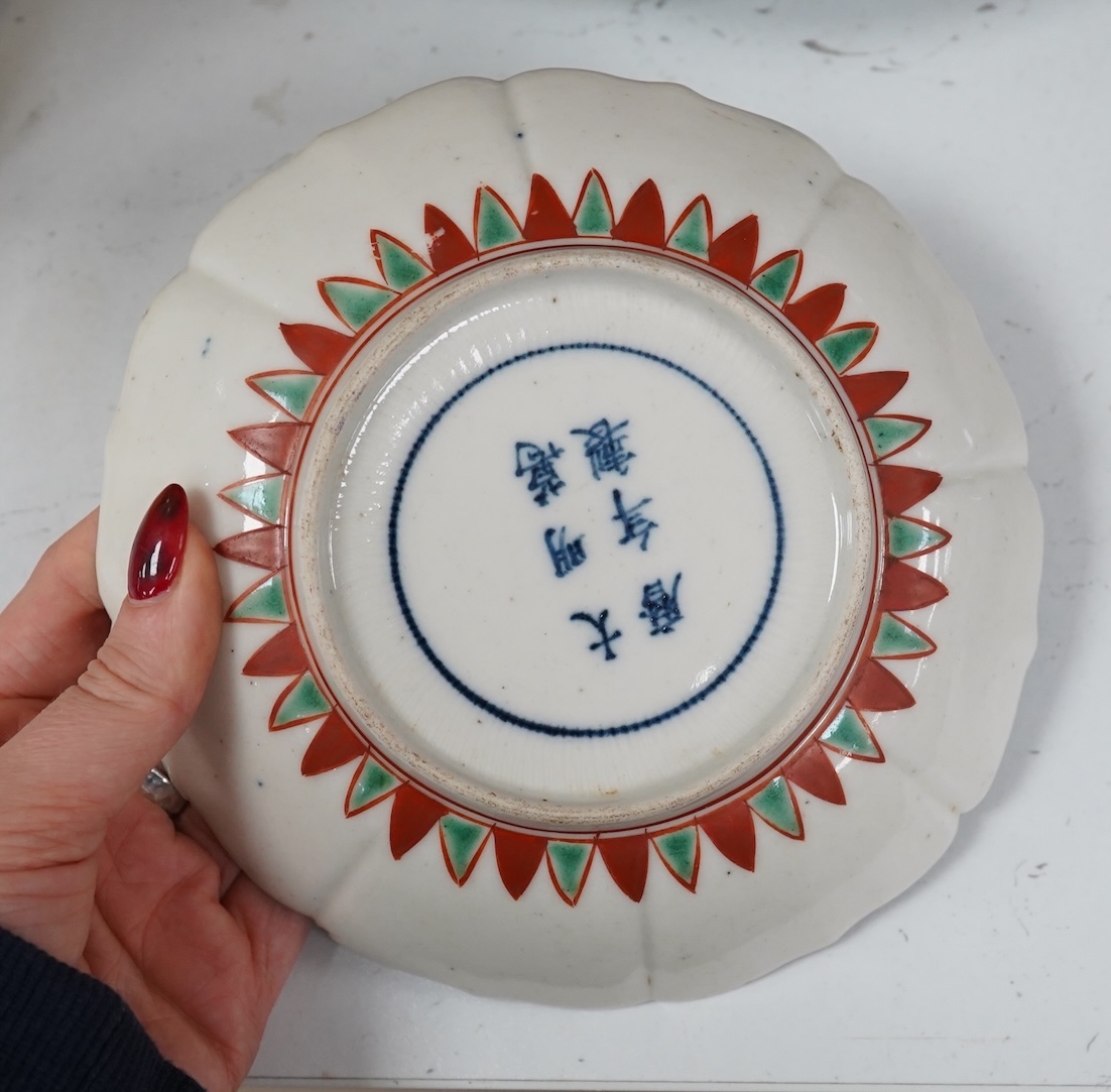 A Chinese famille rose vase, together with a Japanese Imari plate and two others, largest 16cm high. Condition - poor to fair